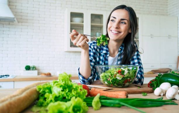 Healthy food to lose weight - a smily lady eating